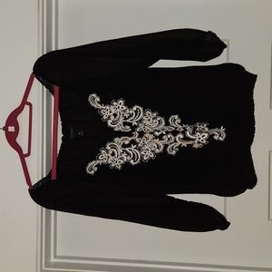 White House Black Market black & white top with sheer sleeves. Size M
